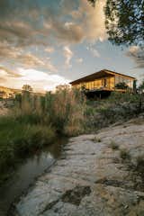 The home is pinned to the slickrock through a mass wall and five hand-carved piers, minimizing excavation and disturbance to the desert ecosystem. 

