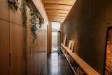 The circulation core becomes  both a passage to the bathing courtyard and a library with custom millwork, built-in shelving, and site-specific art.

