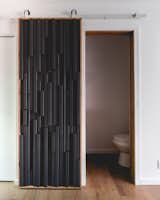 Sliding door made from cutoffs and scraps.  