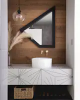 Reclaimed mirror and custom encaustic tile vanity for the downstairs bath.