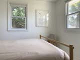 Master bedroom. 
Custom bed frame and Brace stool. 
Artwork: Print by Christophe Niemann