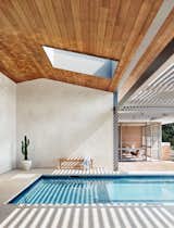 The skylight above the pool is an odd shape, one Corral  describes as a "rectoculus." It’s this spot, in a home full of beautiful moments, that she likes best. Above you is the sky. The rammed earth surrounds you, the view is in front of you, and the shadows of the trellis dance on the gentle waves of the turquoise pool. "It’s the place where you have all the connections," says Corral.