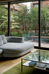 Though the home is located in a dense residential neighborhood, the patio creates a buffer between the interior and the world outside, while still letting in light, greenery, and fresh air