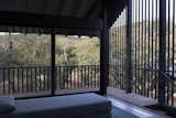 The meditation studio features a view of the property through black-stained slats.
