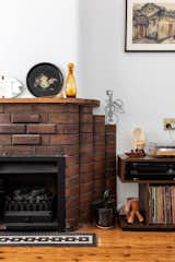 The mantle atop of the fireplace (an original feature of the home that survived the renovation) is the perfect display spot for Rose and Ben’s latest finds. 
