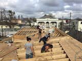 The students of UrbanBuild's class of 2020 get hands on designing the roof of UB15. This roof form, when completed, will bring water to the courtyard of the home.