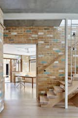 The project’s signature material was discovered on a trip to a recycled brick yard, where Welsch and the homeowners found light, cream-colored bricks and fell in love. "It was a decision made on the spot," explains Welsch. The original plan was to find darker materials that would make the home feel more cozy and cave-like, but the way these bricks reflected the sunlight was just irresistible. "You don’t necessarily expect that soft light feeling from a material like brick."