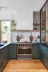 The six-burner La Cornue stove provided visual inspiration for the eclectic, vintage finishes throughout the rest of the home.