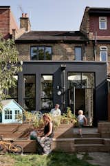 The architects embraced the modernist form of the new structure instead of cladding the extension in expensive brick to match the original Victorian’s exterior.