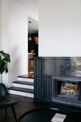 Narrow Diamante tiles surround the fireplace. The wall beside it was able to be moved by just a foot, but it made a huge difference to opening up the space. 