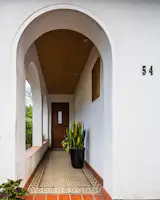 The exterior was resurfaced; the ceiling panelled. With the addition of a few potted plants, and the front walkway looks utterly refreshed.