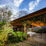 The modular nature of the buildings and rooms allows for flexibility as the family grows and changes.