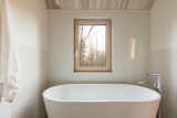 The freestanding tub was oriented precisely so that the bather can enjoy maximum forest views during a soak. 