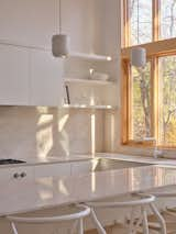 Kitchen, Quartzite Counter, Range, and White Cabinet  Photo 15 of 15 in A Bright and Airy Home Brings Beach Vibes to Urban Toronto