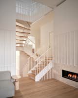 Staircase, Metal Railing, and Wood Tread  Photo 4 of 15 in A Bright and Airy Home Brings Beach Vibes to Urban Toronto
