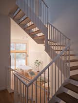 Staircase, Wood Tread, and Metal Railing  Photo 14 of 15 in A Bright and Airy Home Brings Beach Vibes to Urban Toronto