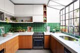 The green backsplash tiles are vintage, reclaimed from another project. 