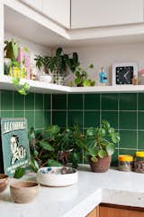 Treasures and finds from trips around the country have found their way into the kitchen display alongside a whole indoor garden of cacti. 