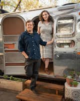 Portrait of Rose Ballard and Paul Suttles in front of the Silver Armadillo Airstream