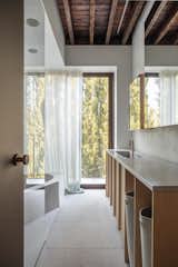 The bath in the ensuite is made of terrazzo. 