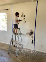 Before: Jade's son helps with demolition.