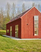 The new addition and old building were clad in the same red timber for a cohesive look. 