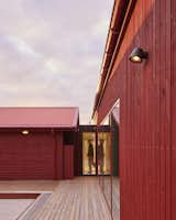 The new house has five exits, including the huge sliding door from the living room to the open space where the hot tub waits. Even the bathroom has a door to the outside. 