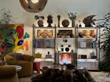 The reading room has a “more masculine energy,” says Matt. The midcentury influence is potent here (though a vintage ‘90s Ikea shelf is the centerpiece) with a more earth-toned palette.