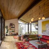 The original layout was very much of the time: a perfect midcentury modern flow, with a closed-off kitchen and a fire put in the floor. “They were cool but impractical spaces,” says Schaer. 