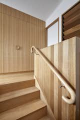 Staircase, Wood Tread, and Wood Railing  Photo 1 of 860 in Innovative home designs, restorations by Trurogirl  from A Mother and Daughter Share an Expanded Weatherboard Cottage That’s Still Just 807 Square Feet