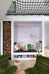 This little nook beneath the Sky Room features a dreamy cloud mural: a snapshot of the sky painted pink and made into a custom wallpaper.