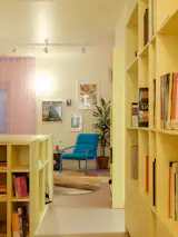 The office features ample storage for books and reference materials. “We have a lot of things that could take over the space,” says Maciagowski. “It’s important to have storage so that everything looks clean and colorful and you don’t have the visual noise of stuff being everywhere.”