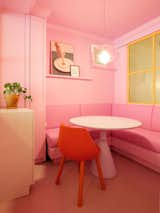 A banquette seat in Perron's office (in bubblegum pink to match the walls, of course) gives the workspace a homey feeling. 