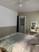BEFORE: The bedroom had brick hidden beneath the drywall.   Photo 10 of 40 in Before & After: This Color-Obsessed Quebec Designer Lives Above Her Studio