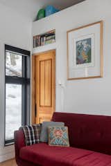 Interior fixtures and finishes were purchased at an auction—like blue mosaic tiles Liz snagged for $30, and the flooring, too. Doors were rescued from an old hotel.