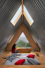 The reading nook is on the other side of the top floor—the sleeping area is in the middle between this area and the tub. 