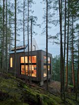 The pre-fab building was fabricated by BC Passive House in Pemberton, British Columbia, and delivered via helicopter to the property in the woods. 