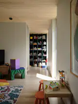 Natural materials and durable finishes accommodate active play in the kids' playroom, without compromising the home's modern aesthetic. 