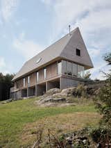 The eastern cedar cladding will develop a gray patina over time.