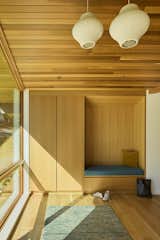 White oak rift-and-quartered cabinetry can be found throughout the home to provide ample storage, completed by Carey's Custom Woodworking.