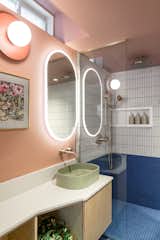 Centura matchstick tile in bone matte pair with Azul Baia porcelain mosaic accents against Benjamin Moore Titanic Rose walls, creating an unexpectedly joyful bathroom.