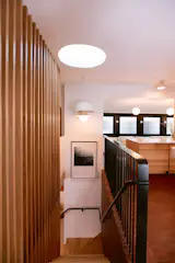 Opening the stairwell transformed circulation from a claustrophobic duck-your-head experience to an elegant transition that connects the two-story home.