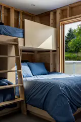 The spare bedroom efficiently accommodates guests within a compact footprint.
