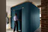 The millwork cube holds a bathroom and storage aplenty, including the front hall closet and mini upper cabinets. 