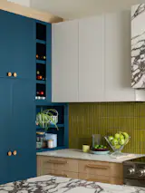 Caesarstone Fresh Concrete countertops line the perimeter cabinets. 