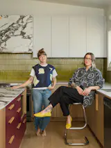 Xenia Rose (left) and Kate Dubois balanced bold color with white and wood for this home renovation and expansion in Ontario. 