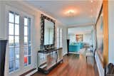 Hallway Entryway / Hallway with views into living/dining room.   Photo 10 of 36 in Buffalo, NY Luxury Penthouse with views of Niagara Falls by Caitlin Johnson