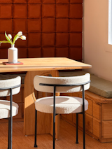 This dining nook provides storage within the benches and extra seating for hosting.