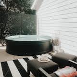 This DIY stock tank pool is where the family cools off in the hot summer months.