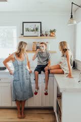 Hanging out in the kitchen is common.